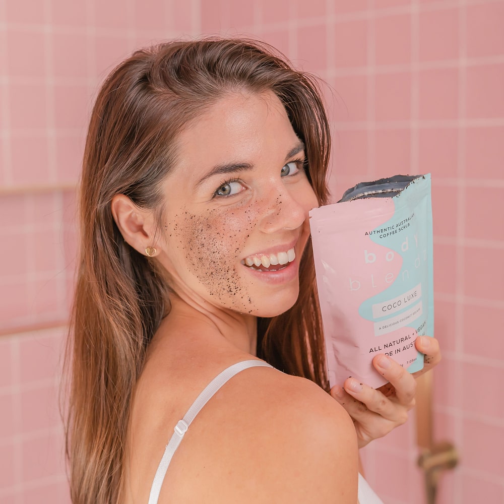 BodyBlendz coco luxe coffee scrub applied on face by model, natural exfoliating scrub for smoother brighter glowing skin