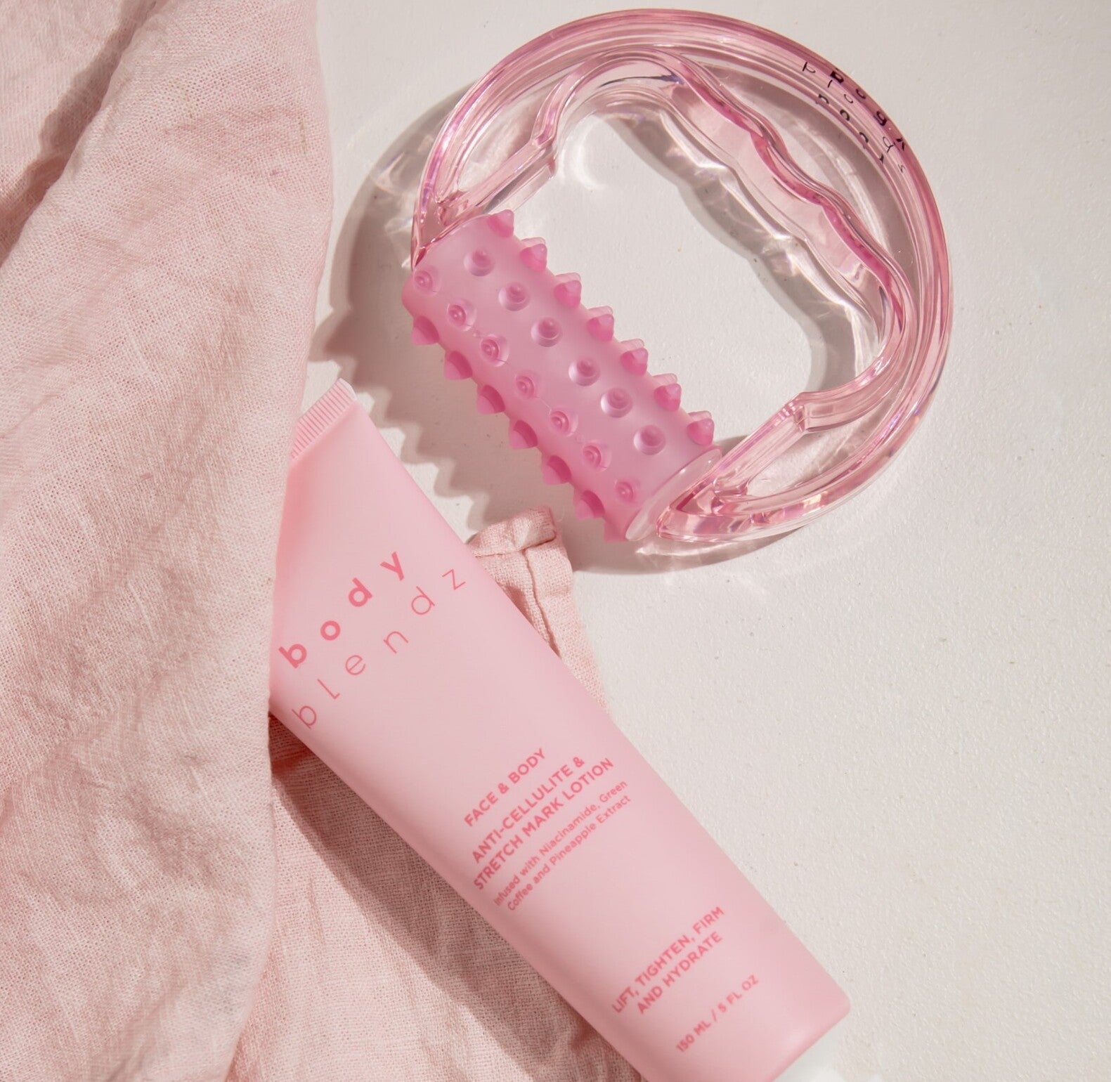 BodyBlendz anti cellulite and stretch mark lotion with pink body massage roller, skincare tools for firming, smoothing and hydrating skin