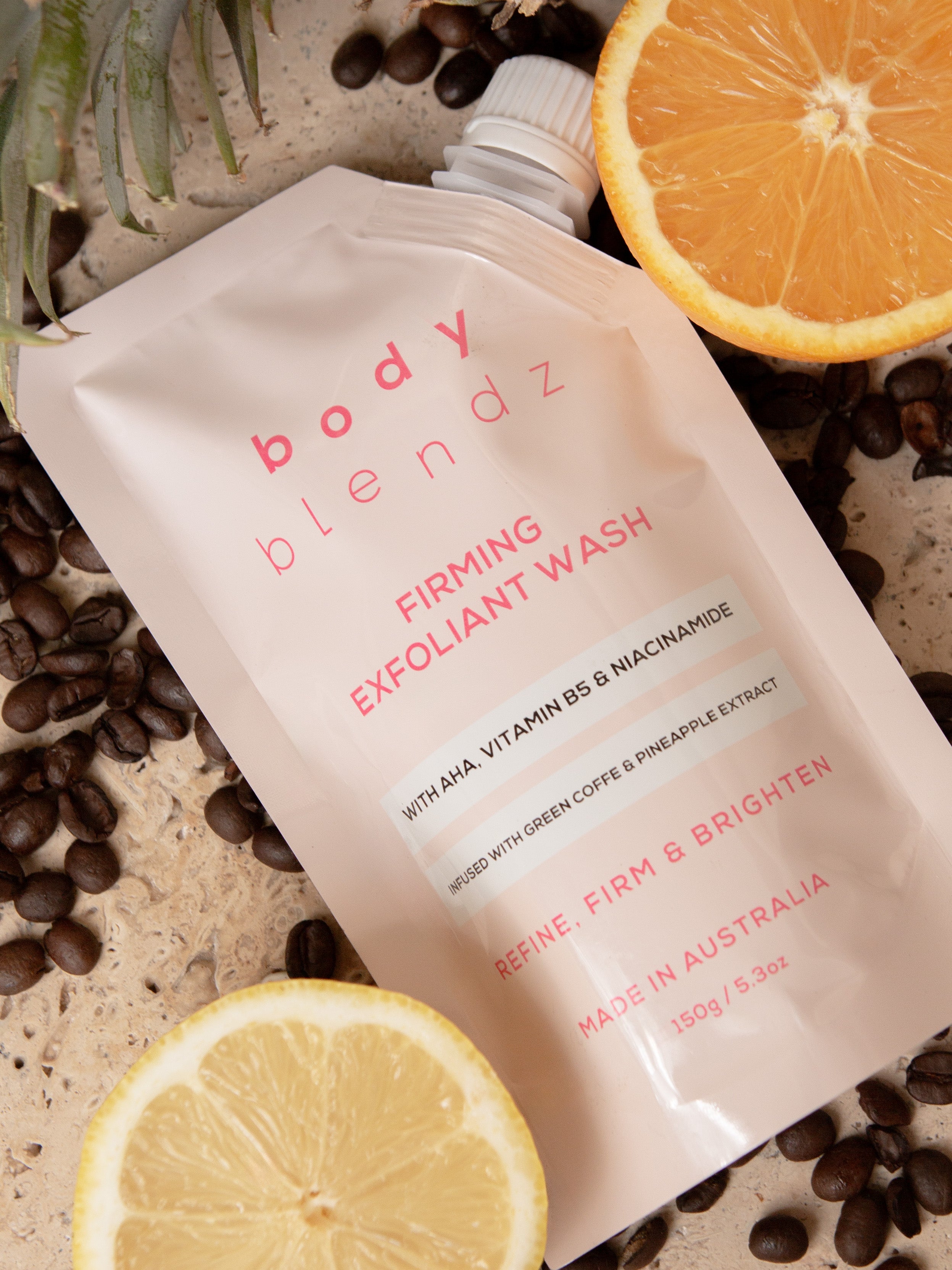 BodyBlendz firming exfoliant wash packaging with coffee beans, AHA body cleanser with niacinamide for smoother brighter skin