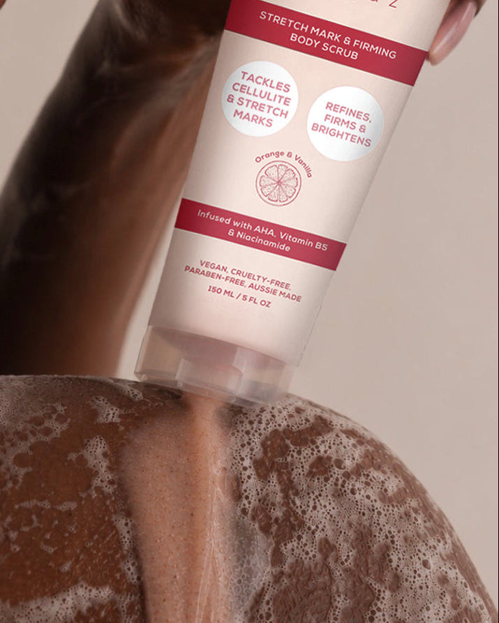 BodyBlendz Stretch Mark & Firming Body Scrub being applied on a woman's back in the shower to exfoliate skin and visibly reduce the appearance of stretch marks and cellulite.