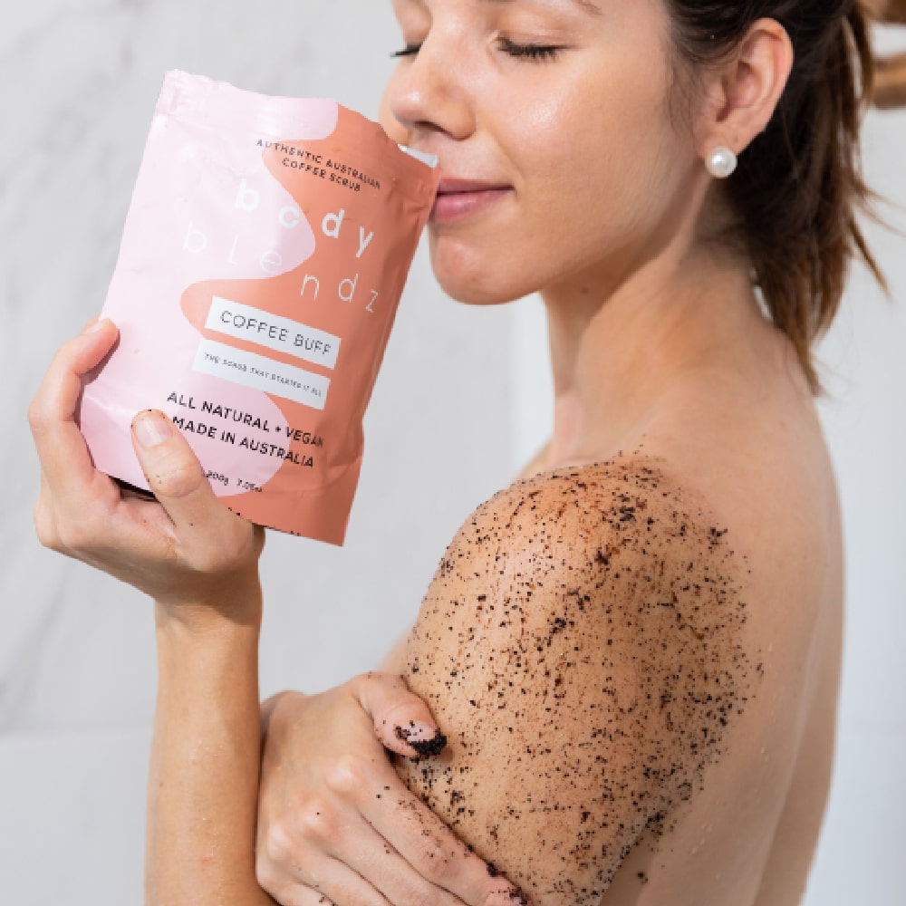 BodyBlendz coffee buff coffee scrub applied on shoulder, natural exfoliating body scrub for smoother softer glowing skin