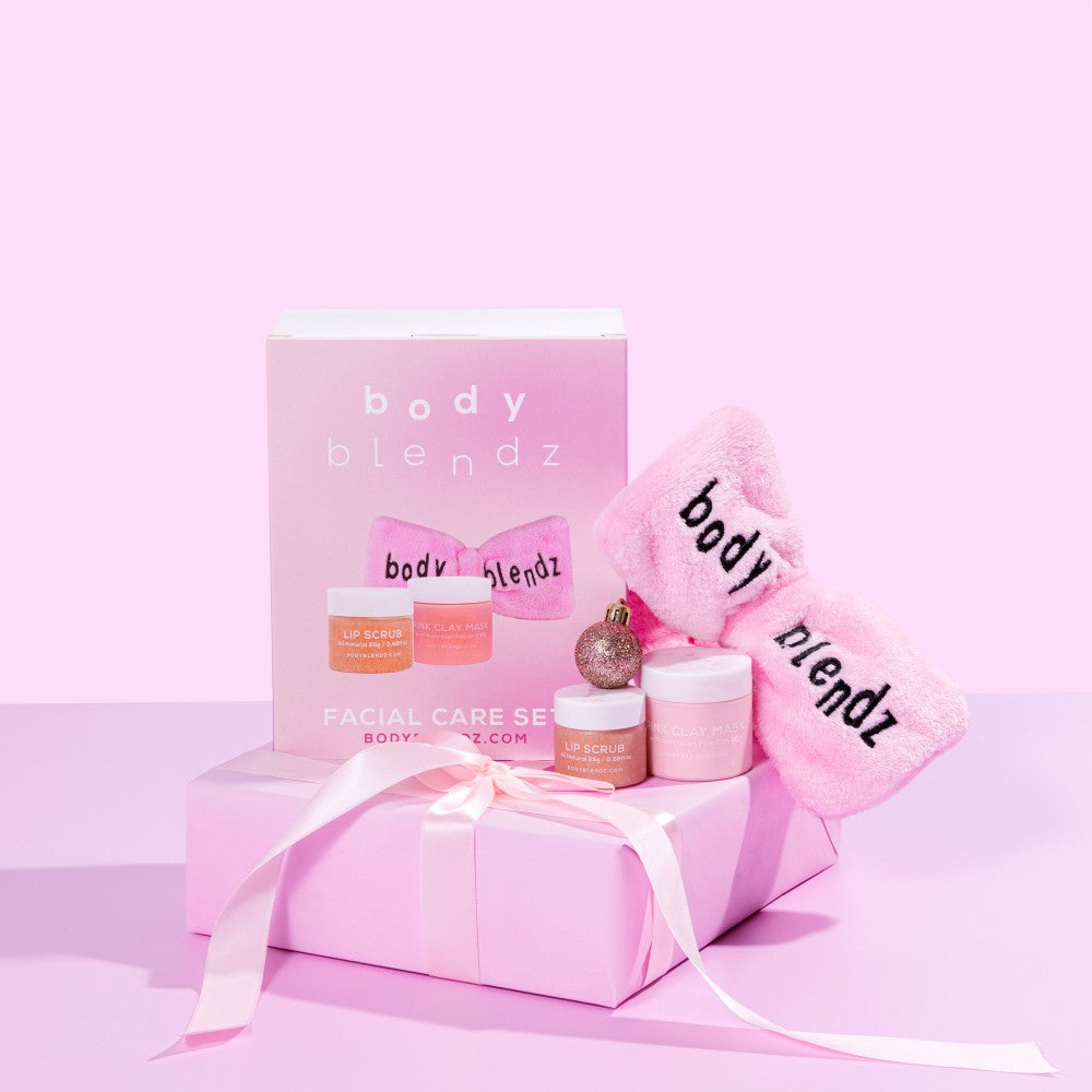 BodyBlendz Facial Care Set gift pack with lip scrub, Australian pink clay mask, and pink skincare headband on wrapped present, perfect self-care gift for glowing skin